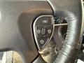 Close-up of the control panel on a 2018 Kenworth T800 truck steering wheel featuring buttons for headlights and fog lights