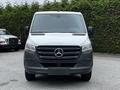 A 2020 Mercedes-Benz Sprinter van with a silver front and black grille displays the iconic Mercedes-Benz logo in the center