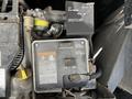 A 2000 Ford Motorhome's control panel featuring circuit breakers and instructions for a pre-heater system