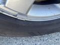 Close-up of a 2013 Ford Expedition tire showcasing the tread pattern and sidewall markings