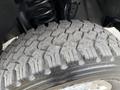 Close-up of a 2019 Ford F-350 SD tire showing a rugged tread pattern designed for off-road performance