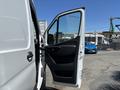 A 2019 Mercedes-Benz Sprinter with an open front door showcasing the interior and dashboard area