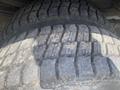 A close-up view of a worn tire tread from a 2007 Morgan Olson Workhorse W42 showing visible cracks and significant wear on the rubber surface