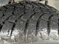 Close-up of a wet tire tread on a 2019 RAM 1500 Classic showcasing deep grooves and patterns designed for traction on various surfaces