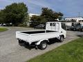 2004 Toyota Toyoace pickup truck with a white flatbed and cab visible from the rear angle