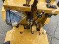 A yellow 2024 AGT KRW 23 Mini loader with control levers buttons and hydraulic connections visible on the top surface