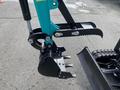A 2024 AGT Industrial QH13R Mini Excavator attachment featuring a digging bucket with sharp teeth and a claw for gripping soil or materials