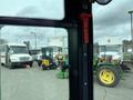 A 2024 AGT Industrial Yellow H13R Mini Excavator viewed from the cabin with controls and interior details visible