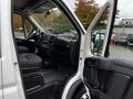 Interior view of a 2016 RAM Promaster showing the driver's seat dashboard and open side door