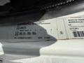 Label on a 2009 International 7500 truck displaying specifications such as weight capacity and manufacturing details