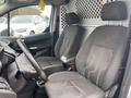Interior of a 2017 Ford Transit Connect showing two black front seats and a steering wheel