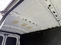 The interior ceiling of a 2022 Ford Transit showing a white finish with rectangular insulation patches