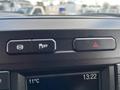 Dashboard controls of a 2017 Ford F-250 SD featuring buttons for traction control and hazard lights with a digital display showing temperature and time