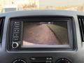 Dashboard display of a 2021 Nissan NV200 showing a rearview camera view with guide lines for parking assistance