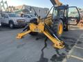 A yellow 2013 JCB 510-56 Loadall with a front loading arm and large tires positioned on a paved surface