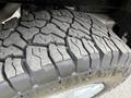 Close-up of a tire tread from a 2022 Ford Transit showing deep grooves and patterns designed for traction and performance