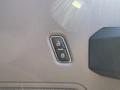 Close-up of a lock and unlock button on the door panel of a 2017 Ford F-350 SD