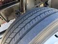 Close-up of a tire from a 2019 Freightliner MT45 showing detailed tread patterns and a sturdy rubber composition