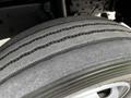 Close-up of a tire from a 2018 Hino 195 showing distinct tread patterns and the rubber surface detailing