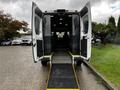 Rear view of a 2016 RAM Promaster with open double doors and a lowered ramp for accessibility