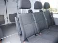 Interior of a 2016 Mercedes-Benz Sprinter featuring three rows of black fabric seats with seat belts attached
