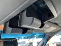 Interior view of a 2014 Ford F-150 with overhead storage compartments above the windshield