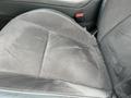 A black cloth seat in a 2017 Dodge Challenger with a slightly worn surface and visible texture patterns