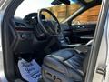 Interior of a 2013 Lincoln MKT showcasing black leather seats and a modern dashboard with a steering wheel and control panel visible