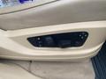 A control panel for seat adjustments in a 2009 BMW X5 featuring buttons for memory settings and seat positioning controls