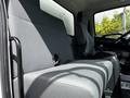 Interior view of a 2020 Hino 338 showing the driver's seat and passenger seat both upholstered in gray fabric with a simple and functional design