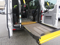 A 2009 Dodge Sprinter Van with an accessible ramp extended from the rear for easy entry and exit