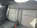The rear seats of a 2005 Chrysler PT Cruiser with dark fabric upholstery and seatbelts visible