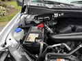 A 2018 Ford F-150 engine compartment showcasing the battery and various engine components
