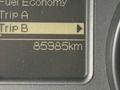 A digital display showing trip information from a 2013 RAM 3500 indicating a distance of 85985 kilometers