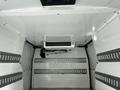 Interior view of a 2019 Ford Transit Connect with a ceiling-mounted Zanotti refrigeration unit and horizontal metal strips on the walls for securing cargo