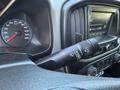 The interior dashboard of a 2018 GMC Canyon showing the speedometer and a control stalk for windshield wipers and turn signals