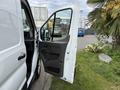 2022 Ford Transit van with the driver's side door open showcasing the interior and controls
