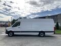 A white 2019 Mercedes-Benz Sprinter van with no windows on the sides and a low roof design