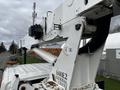 A 2008 International 7500 equipped with a National Crane 600E2 boom lift positioned for operations