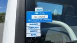 A 2006 Ford LCF 550 displaying a blue Certificate of Approval sticker from British Columbia with expiration date and months listed underneath