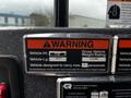 A warning sticker on a 2009 Spartan Gladiator displaying vehicle height weight rating and carrying capacity details