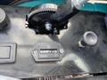 Close-up of the control panel of a 2024 AGT Industrial QH13R Mini Excavator featuring hour meter and gear mechanism