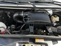 A 2017 Mercedes-Benz Sprinter engine compartment showing various engine components including air intake and fluid reservoirs