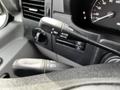 Close-up of the control stalks in a 2017 Mercedes-Benz Sprinter with buttons for resume accelerate and decelerate settings