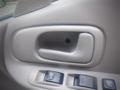 Interior door handle of a 2003 Toyota Toyoace with a button and window controls below it