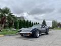 1972 Chevrolet Corvette with a sleek black exterior and distinctive front grille featuring round headlights and a curved body design