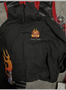 A black hoodie featuring a colorful flame design and the words Big Red Machine on the front