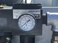 A pressure gauge attached to a 2004 Freightliner M2 shows readings with a dial marked from 0 to 200 PSI