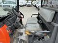 Interior view of a 2011 Kubota RTV 1140 CPX with a worn seat and control panel showing various levers and buttons for operation