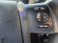Close-up view of the control panel on the steering wheel of a 2014 Ford F-350 SD featuring buttons for media, volume, seek, and confirmation